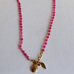 Long Pink Beaded Necklace with Unique Gold Charms